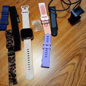 Versa 2 with charger and extra bands